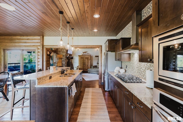 3525 Parrish Ridge Ln, Goreville, IL 62939 - kitchen with wooden ceiling, a kitchen breakfast bar, wall chimney range hood, appliances with stainless steel finishes, and dark brown cabinetry