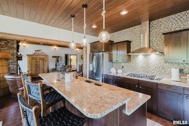 3525 Parrish Ridge Ln, Goreville, IL 62939 - kitchen with wall chimney range hood, appliances with stainless steel finishes, open floor plan, dark wood finished floors, and wood ceiling