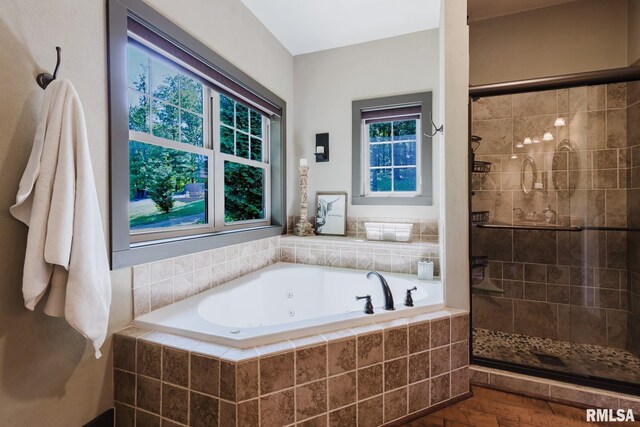 3525 Parrish Ridge Ln, Goreville, IL 62939 - bathroom with a whirlpool tub, a stall shower, and wood finished floors