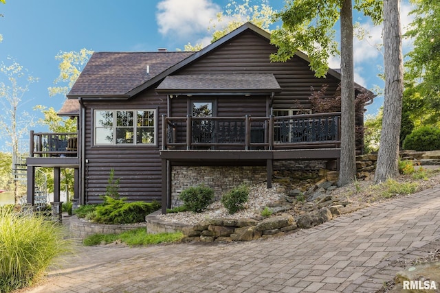 3525 Parrish Ridge Ln, Goreville, IL 62939 - rear view of property featuring a wooden deck, faux log siding, and roof with shingles