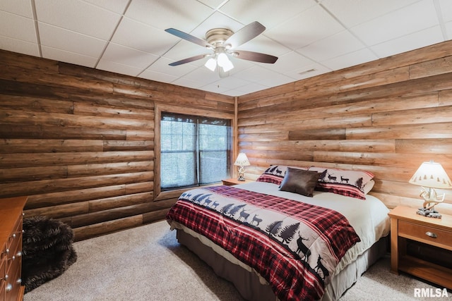 3525 Parrish Ridge Ln, Goreville, IL 62939 - carpeted bedroom featuring log walls, a paneled ceiling, and a ceiling fan