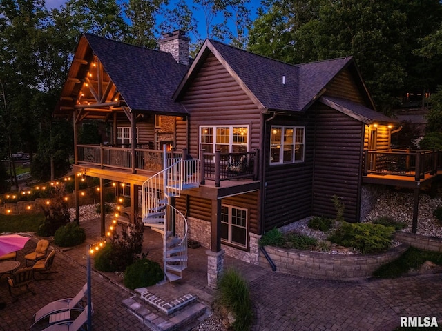 3525 Parrish Ridge Ln, Goreville, IL 62939 - back of property featuring a patio area, stairs, a shingled roof, and a deck