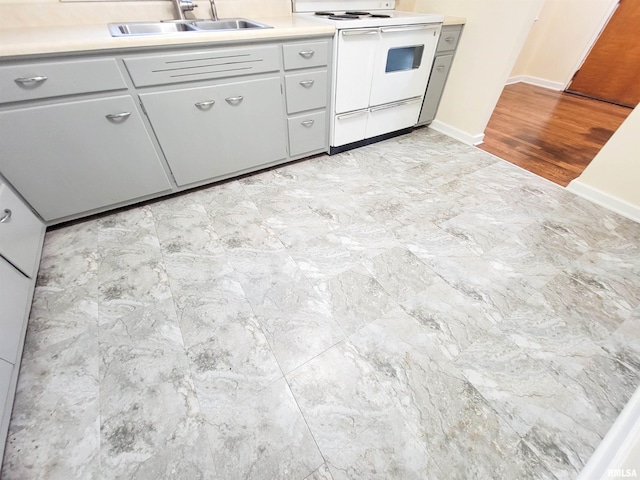 119 S 6th St SE, Clay City, IL 62824 - kitchen with white electric range oven and light countertops