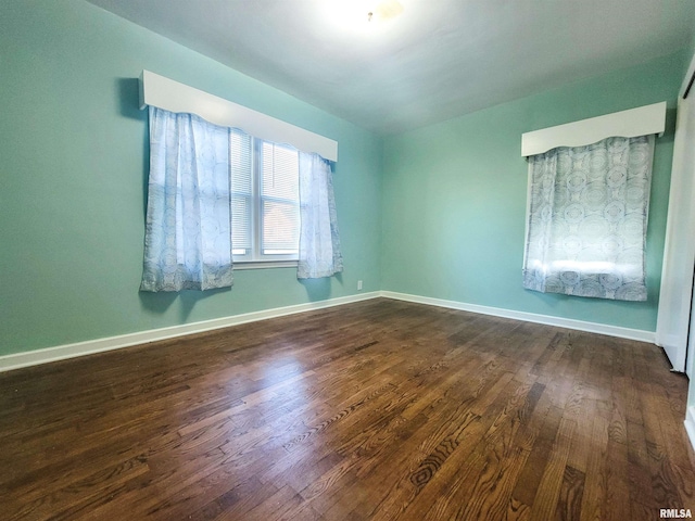 119 S 6th St SE, Clay City, IL 62824 - empty room featuring dark wood-style flooring