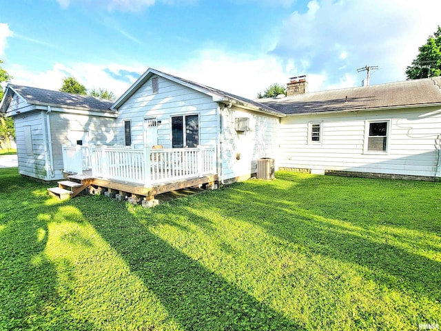119 S 6th St SE, Clay City, IL 62824 - rear view of house with a deck, a chimney, a lawn, and roof with shingles