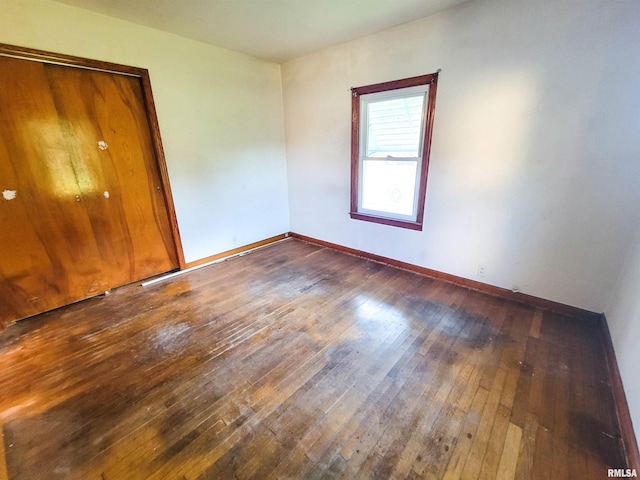 119 S 6th St SE, Clay City, IL 62824 - spare room with wood-type flooring and baseboards