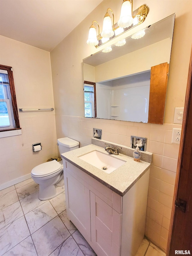 119 S 6th St SE, Clay City, IL 62824 - bathroom with tile walls, vanity, marble finish floors, a chandelier, and wainscoting