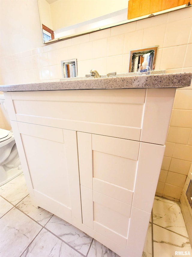 119 S 6th St SE, Clay City, IL 62824 - bathroom with marble look tile flooring and vanity