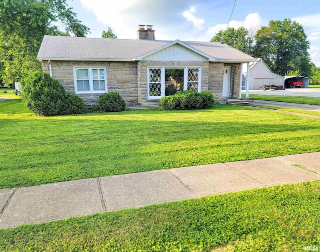 119 S 6th St SE, Clay City, IL 62824 - ranch-style home with stone siding, a front yard, and a chimney