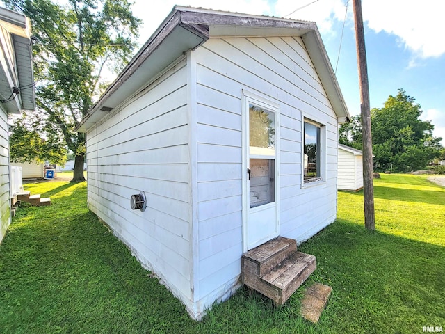 119 S 6th St SE, Clay City, IL 62824 - view of home's exterior featuring entry steps and a yard