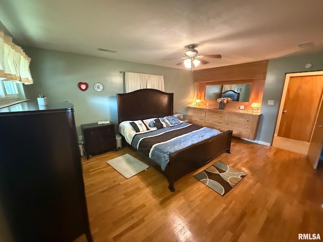 303 S College Blvd, Carmi, IL 62821 - bedroom featuring wood finished floors and ceiling fan