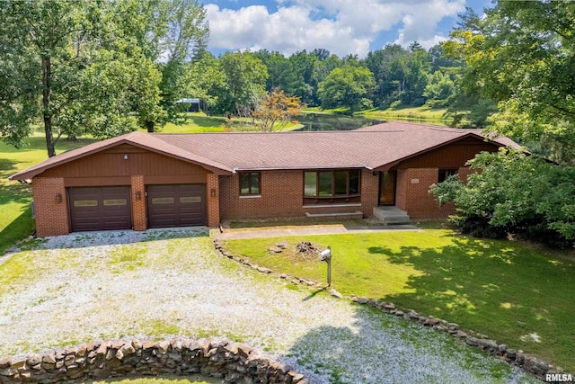 2723 Country Club Rd, Carbondale, IL 62901 - ranch-style home featuring driveway, an attached garage, brick siding, and a front lawn