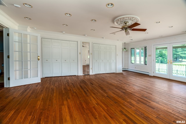 2723 Country Club Rd, Carbondale, IL 62901 - unfurnished bedroom with french doors, crown molding, baseboard heating, multiple closets, and access to exterior