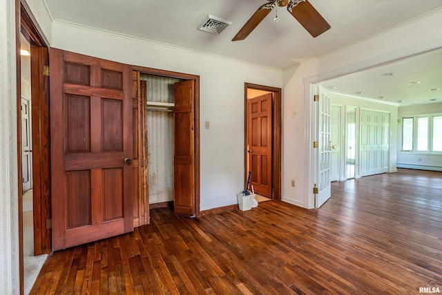 2723 Country Club Rd, Carbondale, IL 62901 - unfurnished bedroom with dark wood-style flooring, ornamental molding, ceiling fan, and a closet