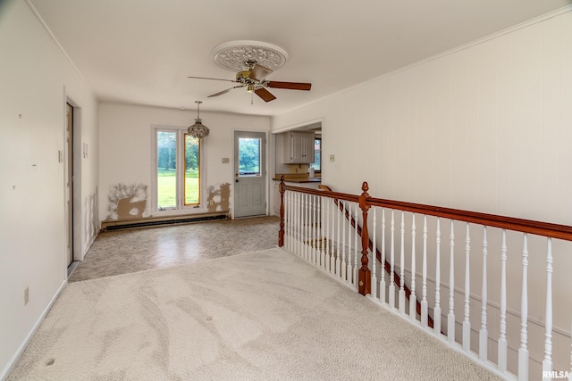 2723 Country Club Rd, Carbondale, IL 62901 - hallway with a baseboard heating unit, carpet flooring, and an upstairs landing