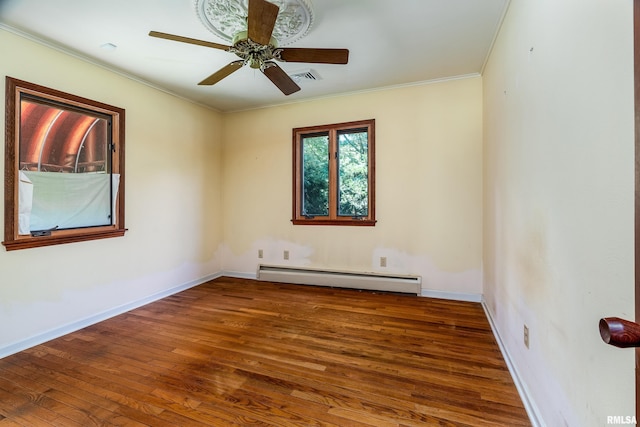 2723 Country Club Rd, Carbondale, IL 62901 - spare room featuring baseboard heating, hardwood / wood-style floors, ceiling fan, and ornamental molding
