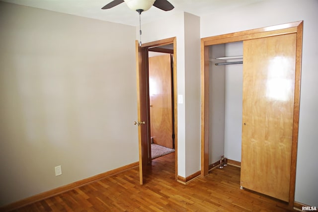 203 Skyline Dr, Marion, IL 62959 - unfurnished bedroom featuring wood finished floors, a closet, and ceiling fan
