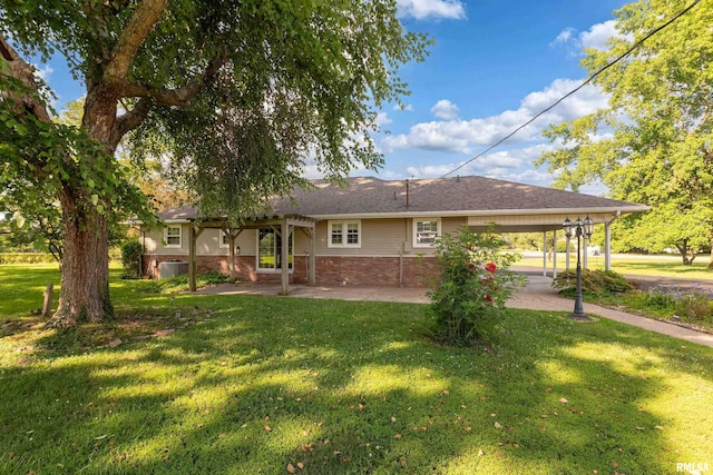 4341 Market Rd, Marion, IL 62959 - back of property featuring a carport and a lawn
