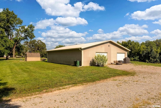 4341 Market Rd, Marion, IL 62959 - view of home's exterior with an outdoor structure, a garage, and a yard