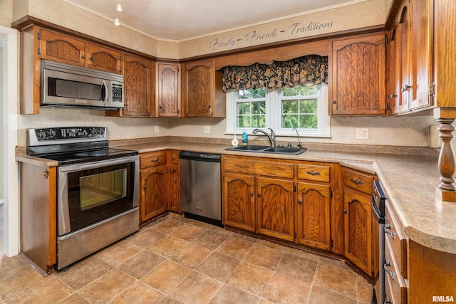 4341 Market Rd, Marion, IL 62959 - kitchen with stainless steel appliances, brown cabinetry, ornamental molding, light countertops, and light stone finish flooring