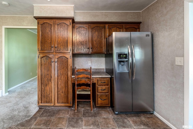 4341 Market Rd, Marion, IL 62959 - kitchen with stainless steel fridge, crown molding, an office area, dark colored carpet, and brown cabinetry