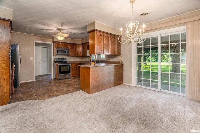 4341 Market Rd, Marion, IL 62959 - kitchen with stainless steel appliances, a chandelier, brown cabinetry, dark carpet, and a peninsula