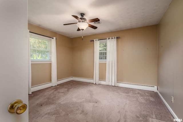 4341 Market Rd, Marion, IL 62959 - unfurnished room featuring plenty of natural light, a ceiling fan, carpet flooring, and baseboard heating