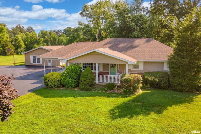 4341 Market Rd, Marion, IL 62959 - ranch-style home featuring a porch, a front yard, driveway, and roof with shingles