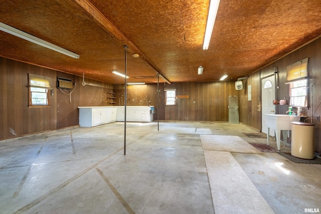 4341 Market Rd, Marion, IL 62959 - garage featuring wooden walls and a wall mounted AC
