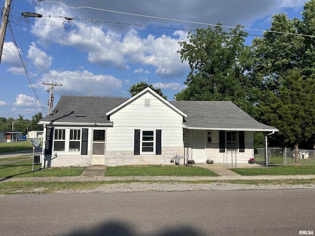 1409 N Van Buren, Marion, IL 62959 - view of front of house featuring a shingled roof, a gate, a porch, and stone siding