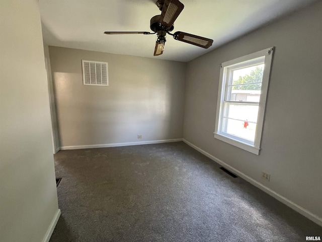1409 N Van Buren, Marion, IL 62959 - empty room with a ceiling fan and dark colored carpet