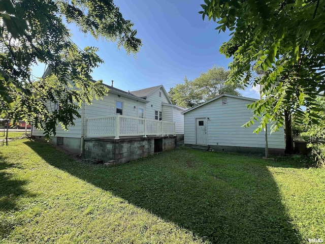 1409 N Van Buren, Marion, IL 62959 - rear view of house featuring a lawn, crawl space, and an outbuilding