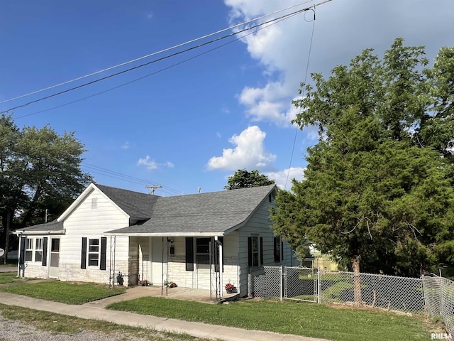 1409 N Van Buren, Marion, IL 62959 - view of front of property with stone siding, a shingled roof, and a porch
