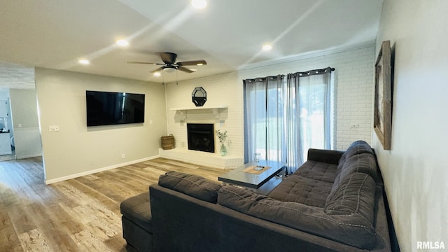 13607 Leisure Ln, Benton, IL 62812 - living area featuring ceiling fan, wood finished floors, recessed lighting, and a fireplace with raised hearth