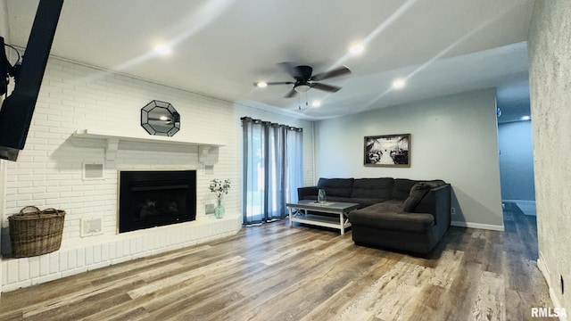 13607 Leisure Ln, Benton, IL 62812 - living area with a ceiling fan, wood finished floors, a fireplace, and recessed lighting