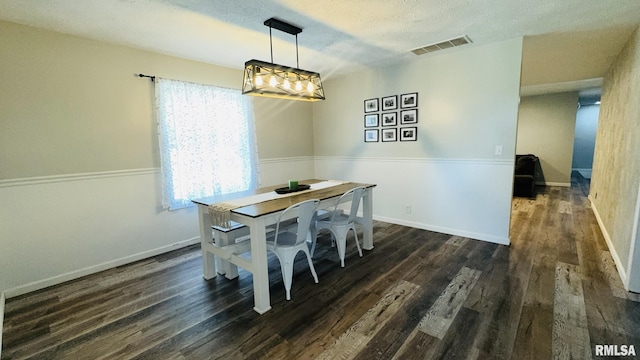 13607 Leisure Ln, Benton, IL 62812 - dining room with wood finished floors and a textured ceiling
