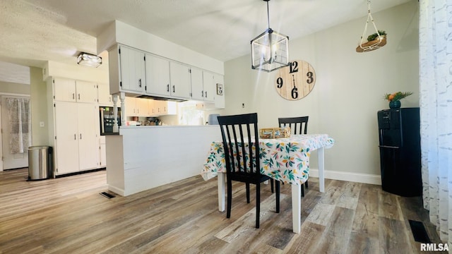 13607 Leisure Ln, Benton, IL 62812 - dining room featuring light wood finished floors and baseboards