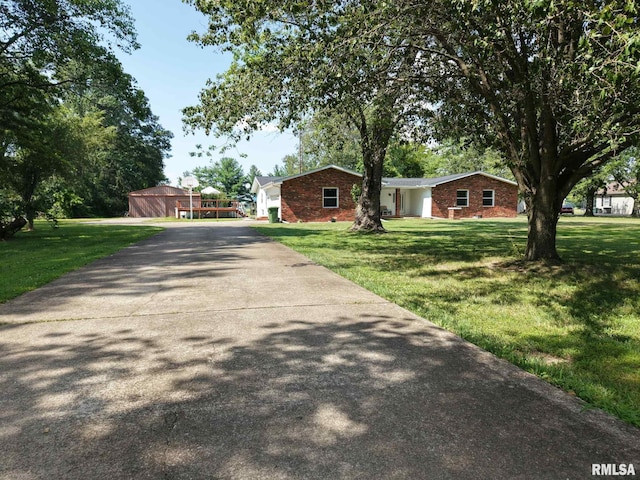 13607 Leisure Ln, Benton, IL 62812 - ranch-style house featuring driveway, a front lawn, brick siding, and a garage