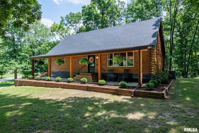 14682 White Birch Ct, Benton, IL 62812 - log-style house with a front lawn, a porch, log siding, and roof with shingles