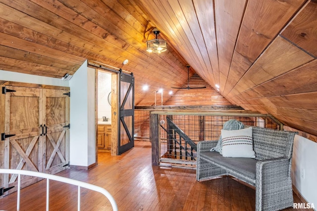 14682 White Birch Ct, Benton, IL 62812 - living area with a barn door, vaulted ceiling, wood-type flooring, wood walls, and wooden ceiling