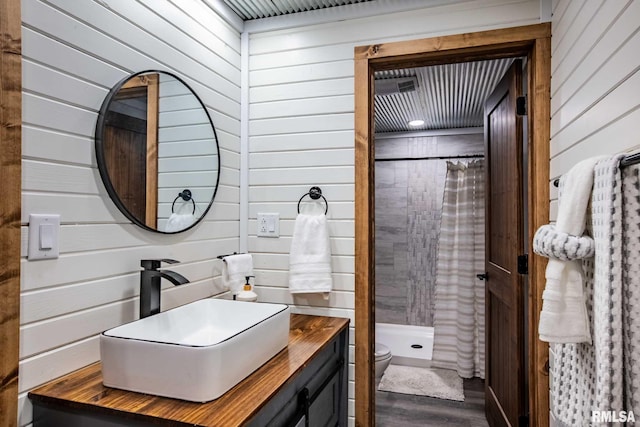 14682 White Birch Ct, Benton, IL 62812 - bathroom with vanity, a shower stall, wood walls, and wood finished floors