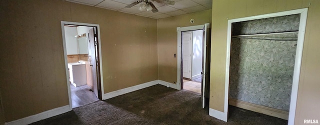 22776 Olive St, Olive Branch, IL 62969 - unfurnished bedroom featuring a drop ceiling, connected bathroom, and carpet floors