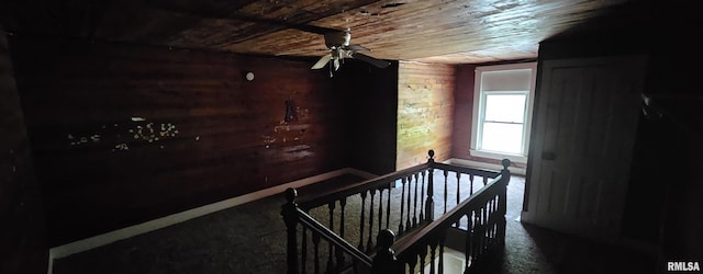 22776 Olive St, Olive Branch, IL 62969 - staircase featuring wood ceiling, wood walls, a ceiling fan, and carpet flooring