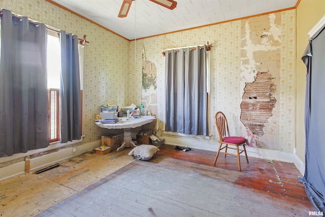 827 W Raymond St, Harrisburg, IL 62946 - interior space featuring crown molding, ceiling fan, wallpapered walls, and hardwood / wood-style floors