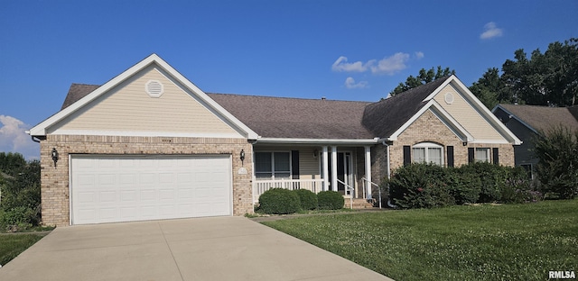 1905 N Dawn Dr, Marion, IL 62959 - view of front facade with brick siding, a porch, driveway, a front yard, and an attached garage