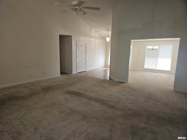 1905 N Dawn Dr, Marion, IL 62959 - carpeted empty room featuring high vaulted ceiling, a chandelier, and a ceiling fan