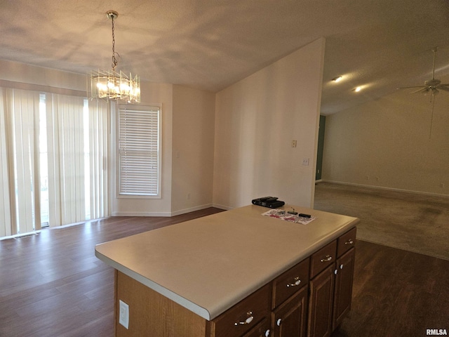 1905 N Dawn Dr, Marion, IL 62959 - kitchen with open floor plan, light countertops, a chandelier, dark wood finished floors, and a kitchen island