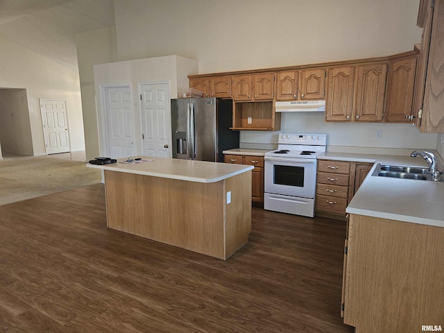 1905 N Dawn Dr, Marion, IL 62959 - kitchen with stainless steel refrigerator with ice dispenser, white electric range, under cabinet range hood, high vaulted ceiling, and a center island