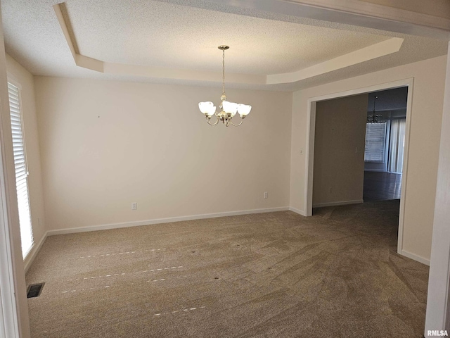 1905 N Dawn Dr, Marion, IL 62959 - carpeted spare room featuring a tray ceiling, a chandelier, and a textured ceiling