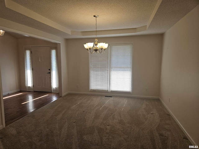 1905 N Dawn Dr, Marion, IL 62959 - foyer featuring a chandelier, carpet, a tray ceiling, and a textured ceiling